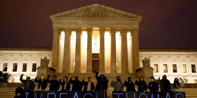 MoveOn activists are calling for the impeachment of Justice Clarence Thomas before the United States Supreme Court on March 30, 2022 in Washington, DC.