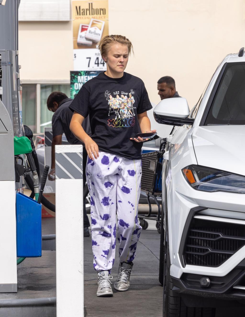 *EXCLUSIVE* Jojo Siwa fuels up his new car and welcomes fans to Tarzana