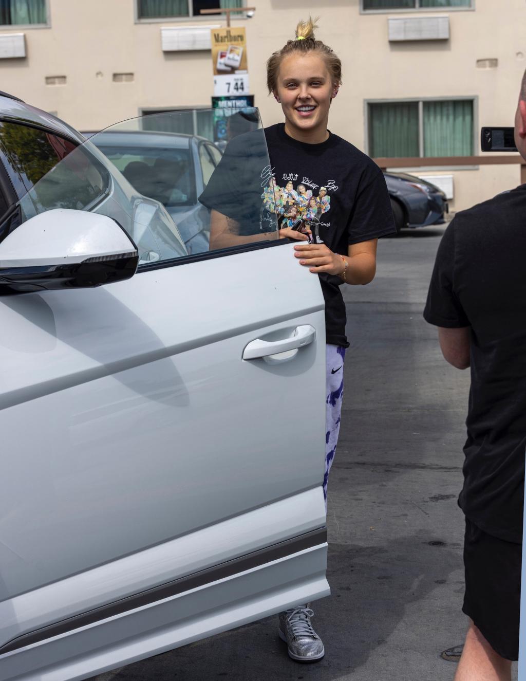 *EXCLUSIVE* Jojo Siwa fuels up his new car and welcomes fans to Tarzana