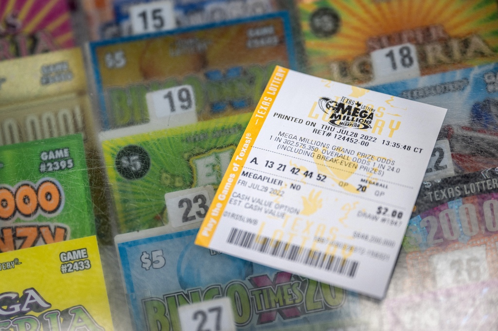 In this photo illustration a lottery ticket is displayed on the counter of a Chevron gas station on July 28, 2022 in Houston, Texas.