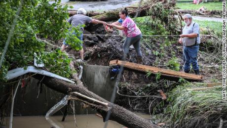 Tonya Smith seeks food from her mother Ollie Jean Johnson to give to her father, who has no powers.  Smith's trailer was swept away by the flood. 