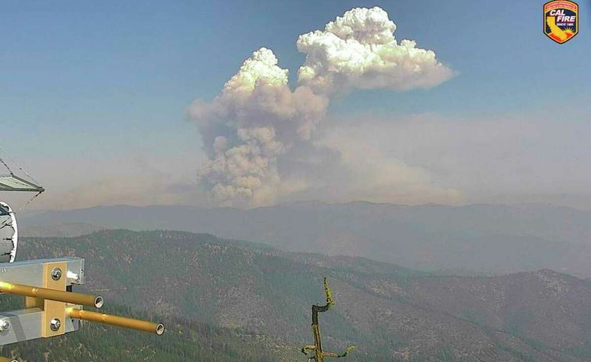 In this remote image provided by Cal Fire, the McKinney Fire burns in Siskiyou County, as seen from the Antelope Mountain Yreka 1 observation camera, early Saturday, July 30, 2022. (Cal Fire via AP)