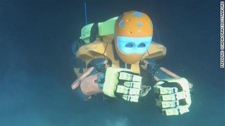 Stanford University's OceanOneK dive robot explores a wreck.