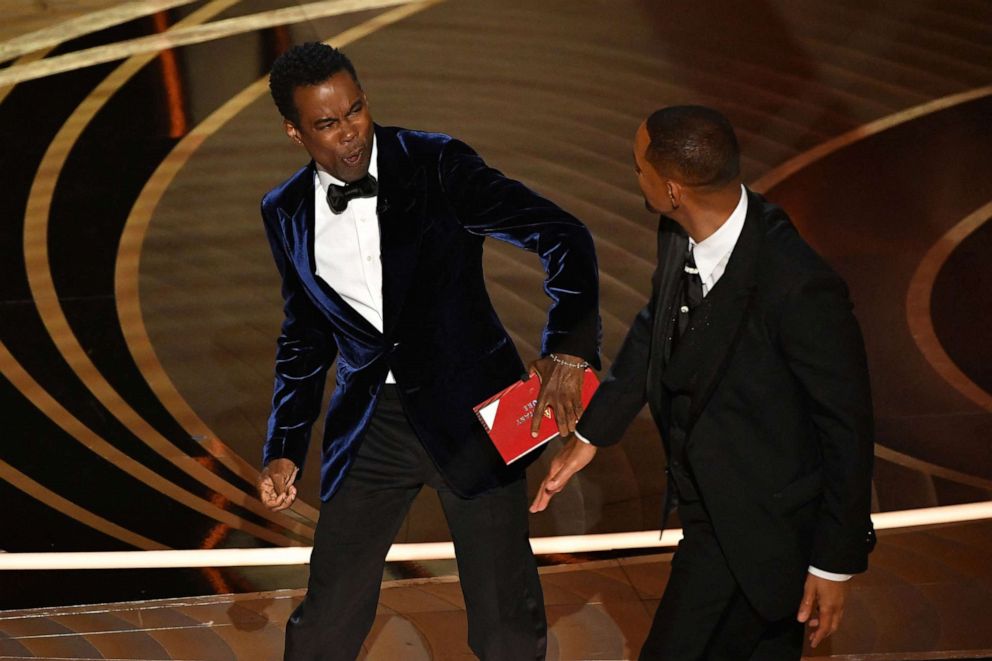 PICTURED: Will Smith, right, slaps Chris Rock onstage after Rock pranks Smith's wife Jada Pinkett Smith at the 94th Academy Awards at the Dolby Theater in Hollywood, California on March 27, 2022. 