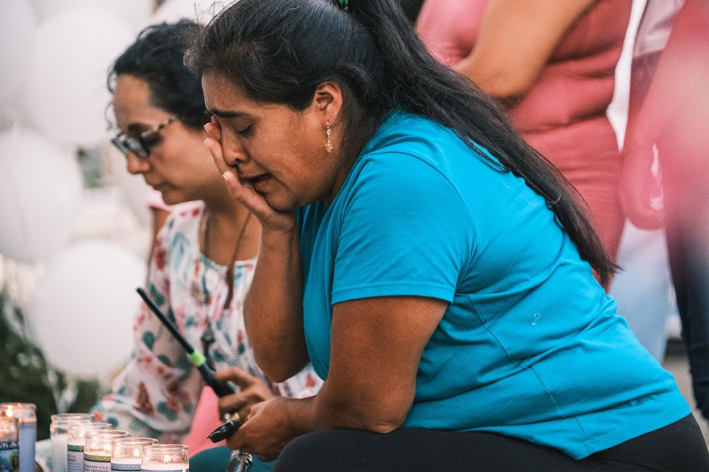 A woman can be seen crying outside Sonia Loja's residence in Danbury, Connecticut on July 28, 2022.